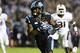 Oct 17, 2013; Chapel Hill, NC, USA; North Carolina Tar Heels wide receiver Quinshad Davis (14) with the ball as Miami Hurricanes defensive back Rayshawn Jenkins (26) and linebacker Tyrone Cornileus (31) defend in the second quarter at Kenan Memorial Stadi
