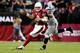 GLENDALE, AZ - OCTOBER 17: Defensive tackle Tony McDaniel #99 of the Seattle Seahawks sacks quarterback Carson Palmer #3 of the Arizona Cardinals in the first quarter during a game at the University of Phoenix Stadium on October 17, 2013 in Glendale, Ari