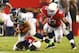 Oct 17, 2013; Phoenix, AZ, USA; Seattle Seahawks quarterback Russell Wilson (3) is pursued by Arizona Cardinals defensive end Calais Campbell (93) in the first half at University of Phoenix Stadium. Mandatory Credit: Mark J. Rebilas-USA TODAY Sports