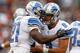 CLEVELAND, OH - OCTOBER 13: Quarterback Matthew Stafford #9 of the Detroit Lions celebrates a touchdown by running back Reggie Bush #21 against the Cleveland Browns at FirstEnergy Stadium on October 13, 2013 in Cleveland, Ohio. (Photo by Matt Sullivan/G