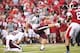 Sep 28, 2013; Fayetteville, AR, USA; Texas A&M Aggies kicker Josh Lambo (49) kicks an extra point during the first half as holder Drew Kaser (38) holds during the first quarter against the Arkansas Razorbacks at Donald W. Reynolds Razorback Stadium. Manda