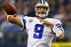 ARLINGTON, TX - OCTOBER 13: Tony Romo #9 of the Dallas Cowboys looks for an open receiver against the Washington Redskins in the third quarter on October 13, 2013 in Arlington, Texas. The Cowboys beat the Redskins 31-16. (Photo by Tom Pennington/Getty I