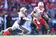 SEATTLE - SEPTEMBER 18: Quarterback Taylor Martinez #3 of the Nebraska Cornhuskers rushes against Sione Potoa'e #55 of the Washington Huskies on September 18, 2010 at Husky Stadium in Seattle, Washington. (Photo by Otto Greule Jr/Getty Images)