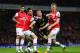 LONDON, ENGLAND - MAY 14: Callum McManaman (C) of Wigan Athletic is tackled by Laurent Koscielny (L) and Per Mertesacker (R) of Arsenal during the Barclays Premier League match between Arsenal and Wigan Athletic at Emirates Stadium on May 14, 2013 in Lon