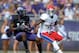 Oct 12, 2013; Fort Worth, TX, USA; TCU Horned Frogs receiver David Porter (14) is defended by Kansas Jayhawks safety Isaiah Johnson (5) at Amon G. Carter Stadium. Mandatory Credit: Kirby Lee-USA TODAY Sports