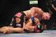 Dec 29, 2012; Las Vegas, NV, USA; Cain Velasquez (top) strikes Junior Dos Santos (bottom) during UFC 155 at the MGM Grand Garden Arena. Mandatory Credit: Gary A. Vasquez-USA TODAY Sports