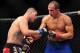 Dec 29, 2012; Las Vegas, NV, USA; Cain Velasquez (left) and Junior Dos Santos (right) during UFC 155 at the MGM Grand Garden Arena. Mandatory Credit: Gary A. Vasquez-USA TODAY Sports