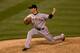 DENVER, CO - AUGUST 27: Javier Lopez #49 of the San Francisco Giants delivers to home plate during the eighth inning against the Colorado Rockies at Coors Field on August 27, 2013 in Denver, Colorado. The Giants defeated the Rockies 5-3. (Photo by Just