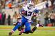 CLEVELAND, OH - OCTOBER 3: Free safety Tashaun Gipson #39 of the Cleveland Browns tackles wide receiver Steve Johnson #13 of the Buffalo Bills during the first half at FirstEnergy Stadium on October 3, 2013 in Cleveland, Ohio. (Photo by Jason Miller/Getty