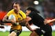 DUNEDIN, NEW ZEALAND - OCTOBER 19: Quade Cooper of the Wallabies charges forward during The Rugby Championship match between the New Zealand All Blacks and the Australian Wallabies at Forsyth Barr Stadium on October 19, 2013 in Dunedin, New Zealand. (Ph