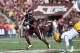 COLLEGE STATION, TX - OCTOBER 20: Ben Malena #1 of the Texas A&M Aggies runs the ball past Craig Loston #6 of the LSU Tigers at Kyle Field on October 20, 2012 in College Station, Texas. (Photo by Ronald Martinez/Getty Images)