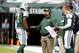 EAST RUTHERFORD, NJ - OCTOBER 13: Offensive coordinator Marty Mornhinweg of the New York Jets talks with quarterback Geno Smith #7 as back up quarterback Matt Simms #5 listens in during a game against the Pittsburgh Steelers at MetLife Stadium on October