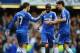 LONDON, ENGLAND - OCTOBER 19: Eden Hazard of Chelsea (L) celebrates with teammate Oscar (R) after scoring his side's fourth goal during the Barclays Premier League match between Chelsea and Cardiff City at Stamford Bridge on October 19, 2013 in London, En