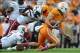 Oct 19, 2013; Knoxville, TN, USA; Tennessee Volunteers wide receiver Jacob Carter (87) is tackled by South Carolina Gamecocks linebacker Sharrod Golightly (9) and linebacker T.J. Holloman (11) during the first quarter at Neyland Stadium. Mandatory Credi