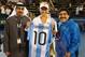 DUBAI, UNITED ARAB EMIRATES - FEBRUARY 21: Caroline Wozniacki of Denmark exchanges gifts with football legend Diego Maradona as they pose for a picture with Salah Tahlak, Tournament Director during day four of the WTA Dubai Duty Free Tennis Championship