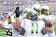 Oct 12, 2013; Seattle, WA, USA; The Oregon Ducks celebrate after Oregon Ducks wide receiver Bralon Addison (11) caught a pass for a touchdown against the Washington Huskies during the 1st half at Husky Stadium. Mandatory Credit: Steven Bisig-USA TODAY Spo