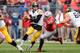 COLUMBUS, OH - OCTOBER 19: Noah Spence #8 of the Ohio State Buckeyes forces quarterback Jake Rudock #15 of the Iowa Hawkeyes out of the pocket in the second quarter at Ohio Stadium on October 19, 2013 in Columbus, Ohio. (Photo by Jamie Sabau/Getty Image