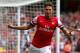 LONDON, ENGLAND - AUGUST 17: Olivier Giroud of Arsenal celebrates after scoring the opening goal during the Barclays Premier League match between Arsenal and Aston Villa at Emirates Stadium on August 17, 2013 in London, England. (Photo by Clive Mason/Ge