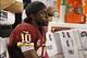 Oct 13, 2013; Arlington, TX, USA; Washington Redskins quarterback Robert Griffin III (10) sits on the bench during the game against the Dallas Cowboys at AT&T Stadium. The Dallas Cowboys beat the Washington Redskins 31-16. Mandatory Credit: Tim Heitman-US