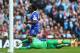 MANCHESTER, ENGLAND - OCTOBER 05: Romelu Lukaka of Everton rounds Joe Hart of Manchester City during the Barclays Premier League match between Manchester City and Everton at the Etihad Stadium on October 5, 2013 in Manchester, England. (Photo by Michael