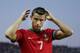 FARO, PORTUGAL - AUGUST 14: Cristiano Ronaldo of Portugal brushes his hair with water prior to start the International Friendly match between Portugal and Netherlands at Estadio Algarve on August 14, 2013 in Faro, Portugal. (Photo by Gonzalo Arroyo Moren