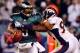 PHILADELPHIA - DECEMBER 27: Donovan McNabb #5 of the Philadelphia Eagles is pressured by Elvis Dumervil #92 of the Denver Broncos on December 27, 2009 at Lincoln Financial Field in Philadelphia, Pennsylvania. The Eagles defeated the Broncos 30-27. (Phot