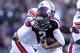 HOUSTON, TX - OCTOBER 19: Johnny Manziel #2 of the Texas A&M Aggies is tackled by Gabe Wright #90 of the Auburn Tigers on October 19, 2013 at Kyle Field in College Station, Texas. Auburn Tigers won 45 to 41.(Photo by Thomas B. Shea/Getty Images)