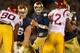 SOUTH BEND, IN - OCTOBER 19: Tommy Rees #11 of the Notre Dame Fighting Irish looks for a receiver as George Uko #90 and Devon Kennard #42 of the University of Southern Califonia Trojans rush at Notre Dame Stadium on October 19, 2013 in South Bend, Indiana