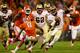 CLEMSON, SC - OCTOBER 19: Jameis Winston #5 of the Florida State Seminoles runs with the ball against Darius Robinson #8 of the Clemson Tigers during their game at Memorial Stadium on October 19, 2013 in Clemson, South Carolina. (Photo by Streeter Lecka
