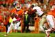 CLEMSON, SC - OCTOBER 19: Tajh Boyd #10 of the Clemson Tigers rushes for a first down during the game against the Florida State Seminoles at Memorial Stadium on October 19, 2013 in Clemson, South Carolina. (Photo by Tyler Smith/Getty Images)