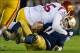 Oct 19, 2013; South Bend, IN, USA; Notre Dame Fighting Irish quarterback Tommy Rees (11) is sacked by USC Trojans linebacker Lamar Dawson (55) in the third quarter at Notre Dame Stadium. Notre Dame won 14-10. Mandatory Credit: Matt Cashore-USA TODAY Sport