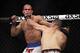 Oct 19, 2013; Houston, TX, USA; Cain Velasquez (red gloves) fights against Junior Dos Santos (blue gloves) in the world heavyweight championship bout during UFC 166 at Toyota Center. Mandatory Credit: Andrew Richardson-USA TODAY Sports