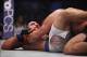 Oct 19, 2013; Houston, TX, USA; Cain Velasquez (red gloves) fights against Junior Dos Santos (blue gloves) in the world heavyweight championship bout during UFC 166 at Toyota Center. Mandatory Credit: Andrew Richardson-USA TODAY Sports