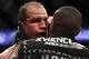 Oct 19, 2013; Houston, TX, USA; Junior Dos Santos (blue gloves) has blood wiped from his face in the world heavyweight championship bout during UFC 166 at Toyota Center. Mandatory Credit: Andrew Richardson-USA TODAY Sports