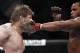 Oct 19, 2013; Houston, TX, USA; Daniel Cormier (red gloves) fights against Roy Nelson (blue gloves) in their heavyweight bout during UFC 166 at Toyota Center. Mandatory Credit: Andrew Richardson-USA TODAY Sports