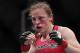 Oct 19, 2013; Houston, TX, USA; Sarah Kaufman (red gloves) fights against Jessica Eye (not pictured) in their women's bantamweight bout during UFC 166 at Toyota Center. Mandatory Credit: Andrew Richardson-USA TODAY Sports
