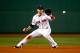 BOSTON, MA - OCTOBER 05: Stephen Drew #7 of the Boston Red Sox fields a ball in the sixth inning against the Tampa Bay Rays during Game Two of the American League Division Series at Fenway Park on October 5, 2013 in Boston, Massachusetts. (Photo by Jare