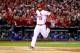 ST LOUIS, MO - OCTOBER 18: Matt Carpenter #13 of the St. Louis Cardinals reacts after scoring a run in the third inning against the Los Angeles Dodgers in Game Six of the National League Championship Series at Busch Stadium on October 18, 2013 in St Loui