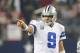 Oct 13, 2013; Arlington, TX, USA; Dallas Cowboys quarterback Tony Romo (9) points as he directs his team in the fourth quarter against the Washington Redskins at AT&T Stadium. The Dallas Cowboys beat the Washington Redskins 31-16. Mandatory Credit: Matthe