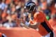 DENVER, CO - OCTOBER 13: Quarterback Peyton Manning #18 of the Denver Broncos directs the offense against the Jacksonville Jaguars at Sports Authority Field at Mile High on October 13, 2013 in Denver, Colorado. The Broncos defeated the Jaguars 35-19. (P