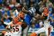 Oct 20, 2013; Detroit, MI, USA; Detroit Lions wide receiver Calvin Johnson (81) catches pass in the end zone while being defended by Cincinnati Bengals outside linebacker Vontaze Burfict (55), free safety Reggie Nelson (20) and strong safety George Iloka