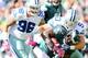 PHILADELPHIA, PA - OCTOBER 20: LeSean McCoy #25 of the Philadelphia Eagles is tackled by Sean Lee #50 and Nick Hayden #96 of the Dallas Cowboys in the first quarter on October 20, 2013 at Lincoln Financial Field in Philadelphia, Pennslyvania. (Photo by
