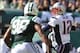 Oct 20, 2013; East Rutherford, NJ, USA; New England Patriots quarterback Tom Brady (12) looks to pass while under pressure from New York Jets defensive end Quinton Coples (98) during the first half at MetLife Stadium. Mandatory Credit: Ed Mulholland-USA T