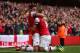 LONDON, ENGLAND - OCTOBER 19: Jack Wilshere of Arsenal celebrates with Olivier Giroud as he scores their first goal during the Barclays Premier League match between Arsenal and Norwich City at the Emirates Stadium on October 19, 2013 in London, England.