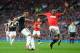 MANCHESTER, ENGLAND - OCTOBER 19: Nathaniel Clyne of Southampton fires in a shot as Danny Welbeck of Manchester United challenges during the Barclays Premier League match between Manchester United and Southampton at Old Trafford on October 19, 2013 in Ma