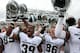 IOWA CITY, IOWA - OCTOBER 5: Defensive end Shilique Calhoun #89, Jermaine Edmondson #39 and Matt Macksood #86 of the Michigan State Spartans sing their fight song after their match-up against the Iowa Hawkeyes on October 5, 2013 at Kinnick Stadium in Iow