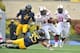 Oct 19, 2013; Morgantown, WV, USA; Texas Tech Red Raiders runner Kenny Williams (34) runs for a first down against West Virginia Mountaineers player Nick Kwiatkoski during the fourth quarter at Milan Puskar Stadium. Texas Tech won West Virginia 37 - 27 Ma