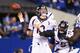 INDIANAPOLIS, IN - OCTOBER 20: Peyton Manning #18 of the Denver Broncos fumbles the ball as he is hit during the game against the Indianapolis Colts at Lucas Oil Stadium on October 20, 2013 in Indianapolis, Indiana. (Photo by Andy Lyons/Getty Images)