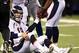 Oct 20, 2013; Indianapolis, IN, USA; Denver Broncos quarterback Peyton Manning (18) is helped up off the ground during the game against the Indianapolis Colts at Lucas Oil Stadium. Mandatory Credit: Brian Spurlock-USA TODAY Sports