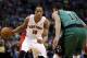 Mar 13, 2013; Boston, MA, USA; Toronto Raptors shooting guard DeMar DeRozan (10) looks for an opening against Boston Celtics shooting guard Courtney Lee (11) during the first quarter at the TD Garden. Mandatory Credit: David Butler II-USA TODAY Sports